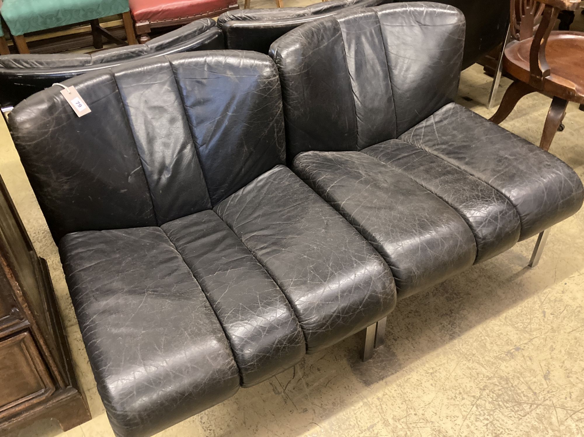 A set of five mid century black leather and chrome banquette chairs, width 65cm, depth 70cm, height 68cm